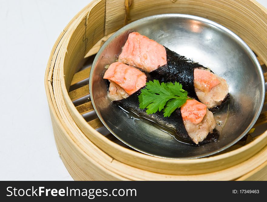 Chinese steamed dimsum in bamboo containers traditional cuisine. Chinese steamed dimsum in bamboo containers traditional cuisine