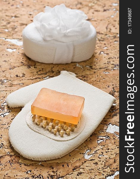 Bath sponge combination with bodymassager and soap on cork wood. Bath sponge combination with bodymassager and soap on cork wood