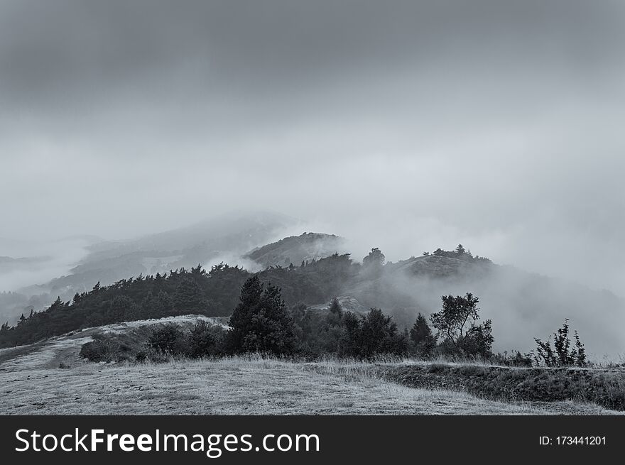 A Warm Summer Early Morning As The Clouds Start To Lift Above The Malvern Hills. Worcestershire, UK