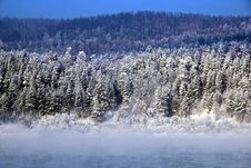 Winter Landscape. In The Background Conifer Winter Forest. In The Foreground - Mist Rising From The Water Stock Image