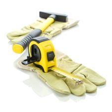 Gloves With Measuring Tape And Hammer Royalty Free Stock Photography Gloves With Measuring Tape And Hammer Royalty Free Stock Photography