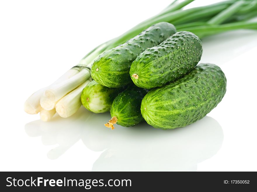 Cucumbers and onion  isolated on white background. Cucumbers and onion  isolated on white background