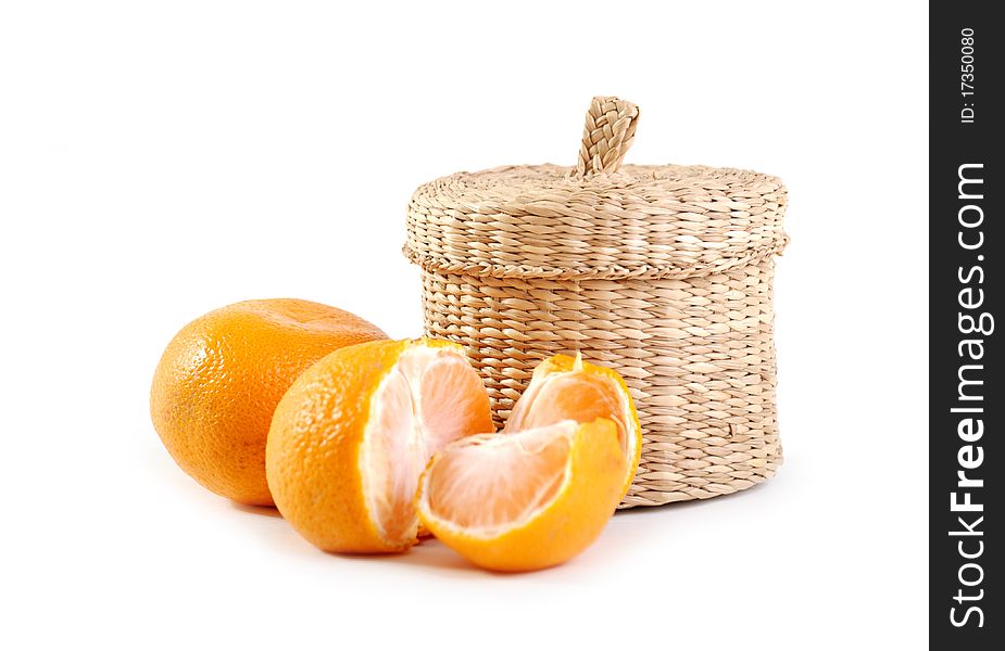 Wicker boxe and mandarin. Isolated on white background.