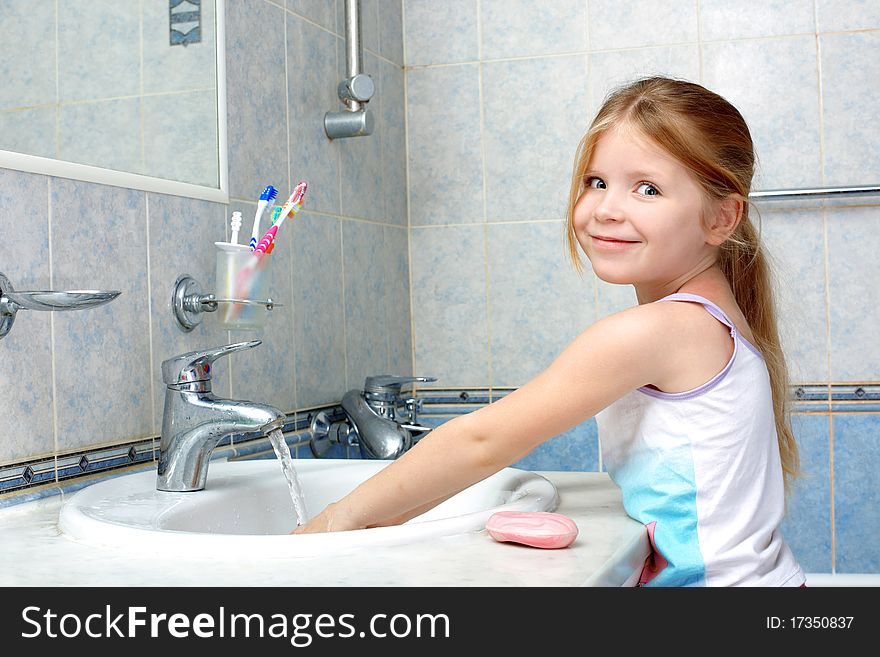 Girl washing in bathroom