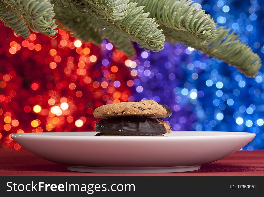 Christmas theme. Christmas tree branch against a background of Christmas decorations. Christmas theme. Christmas tree branch against a background of Christmas decorations.