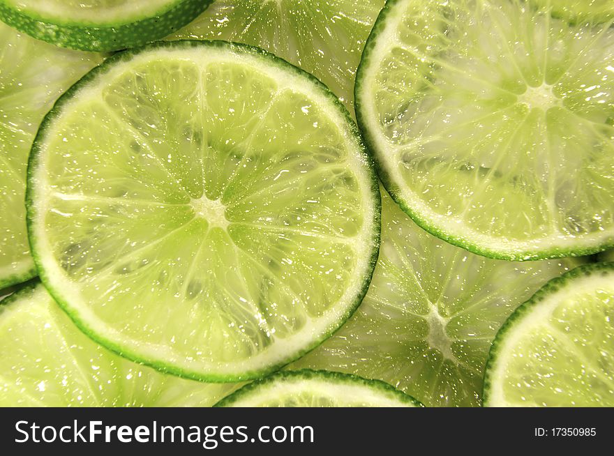 A fresh slice limes isolated on white. A fresh slice limes isolated on white