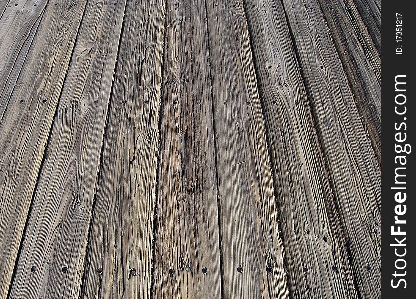 Very old grey wooden boardwalk pattern with nails. Very old grey wooden boardwalk pattern with nails