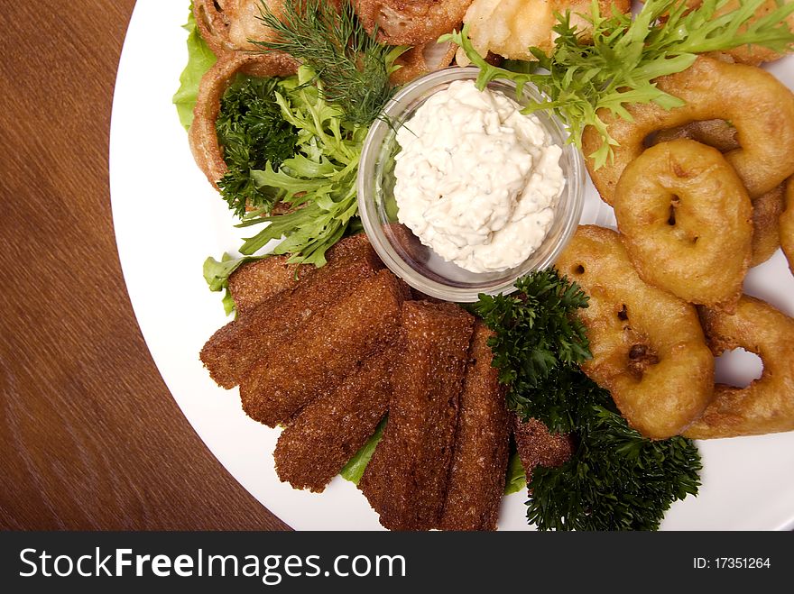 Appetizer made of fried onion, potato and bread. Appetizer made of fried onion, potato and bread