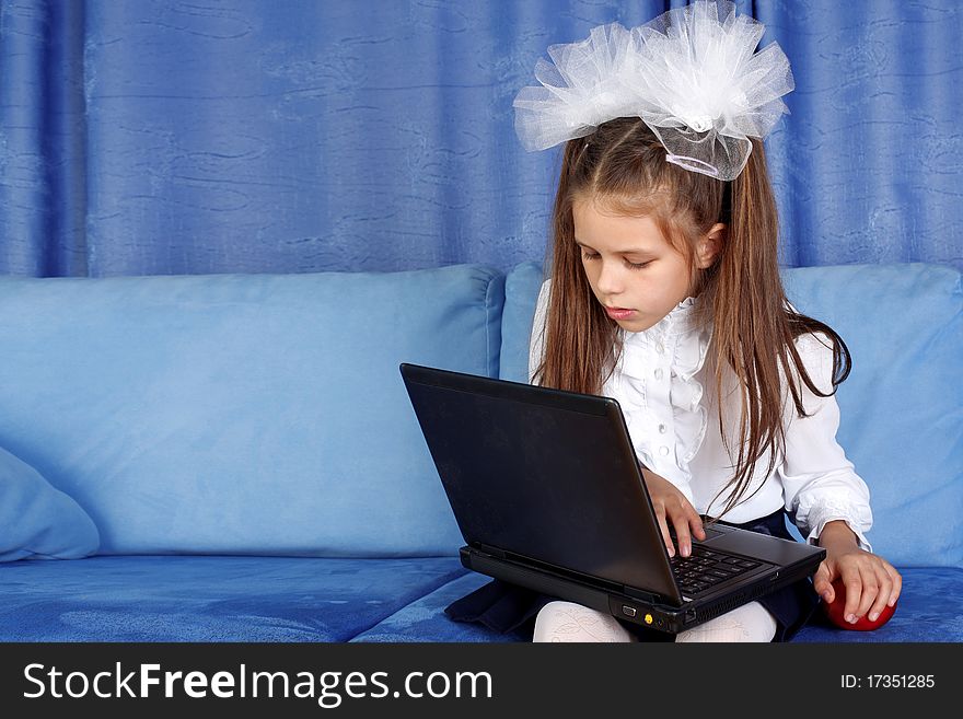 Girl With Laptop And Red Apple