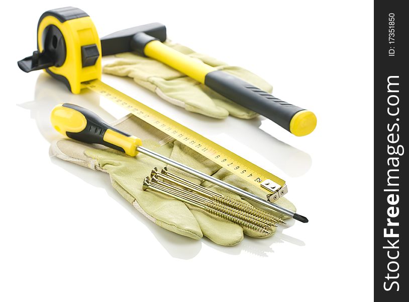 Gloves with working tools isolated on white background