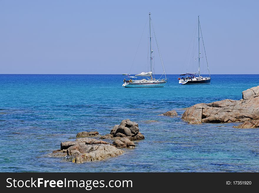 Sailboats Moored In The Beautiful Sea Of Sardinia