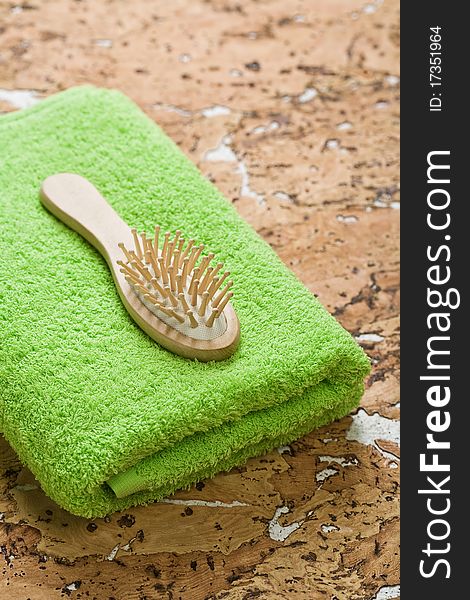 Hairbrush And Towel On Cork Wood