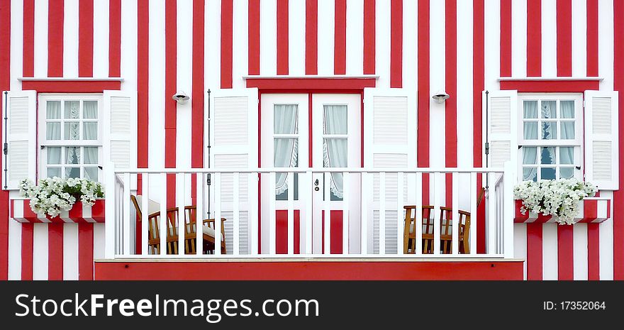 Red striped traditional portuguese wood house. Red striped traditional portuguese wood house.