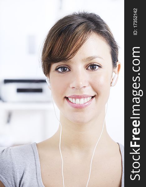 Young Woman Listening Music In Home Interior