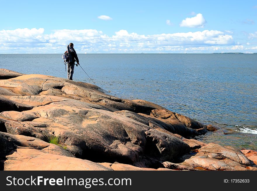 A fisherman angling on the sea