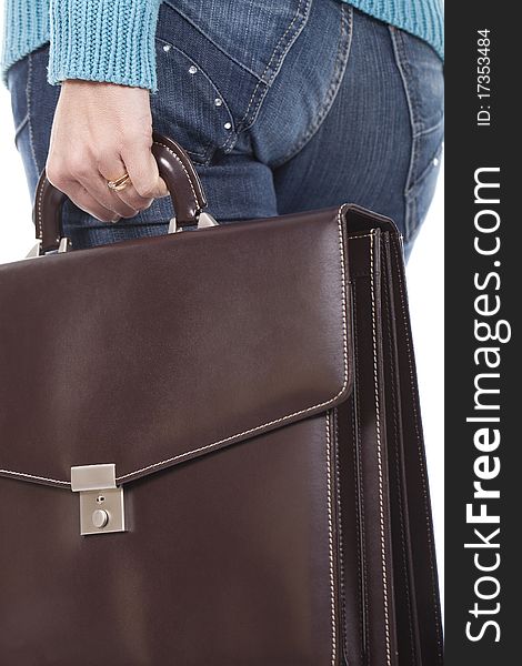 An executive woman is holding a briefcase. An executive woman is holding a briefcase