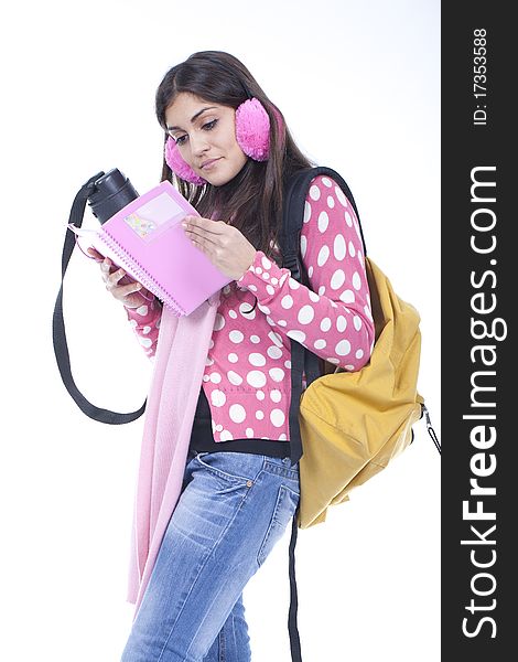 Young student girl reading a book