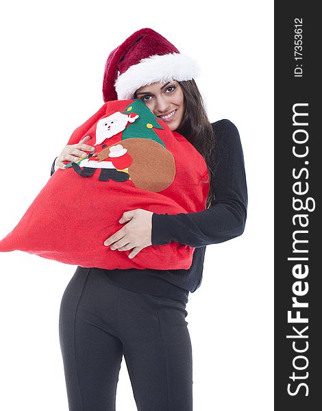 A young woman holding a christmas shopping bag with a christmas hat. A young woman holding a christmas shopping bag with a christmas hat