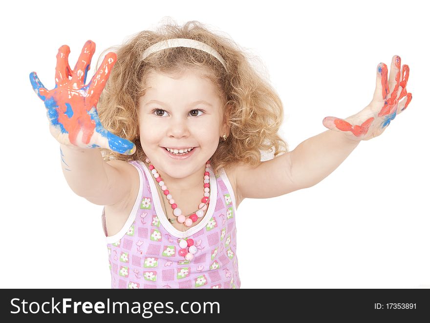 The little girl draws dark blue paints the hand. The little girl draws dark blue paints the hand
