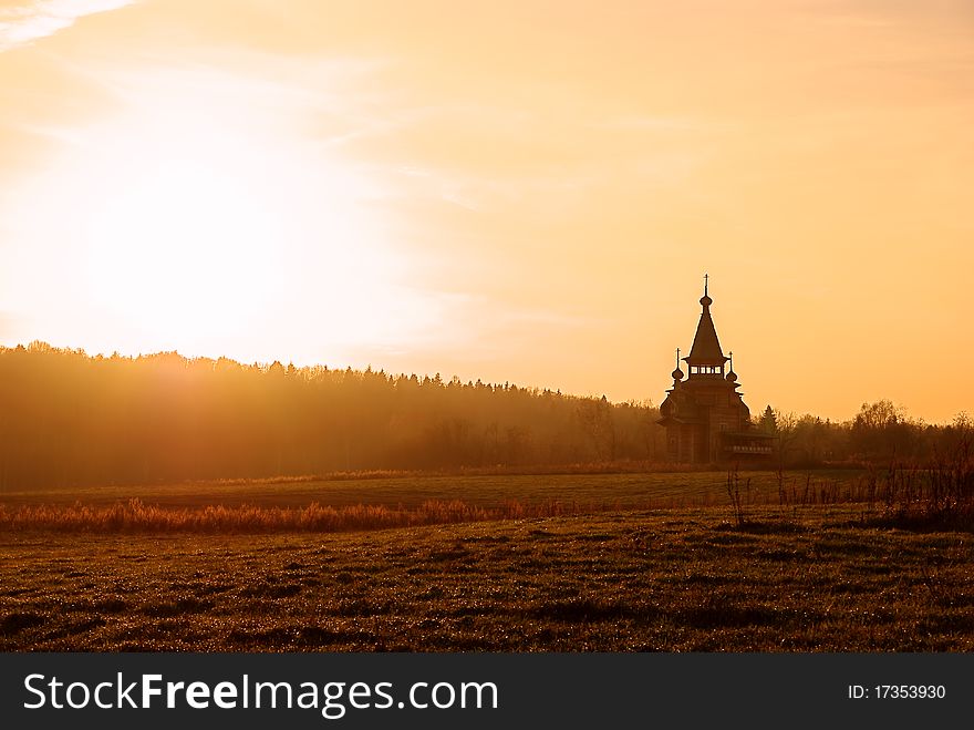 Small wooden church and sunset. Small wooden church and sunset
