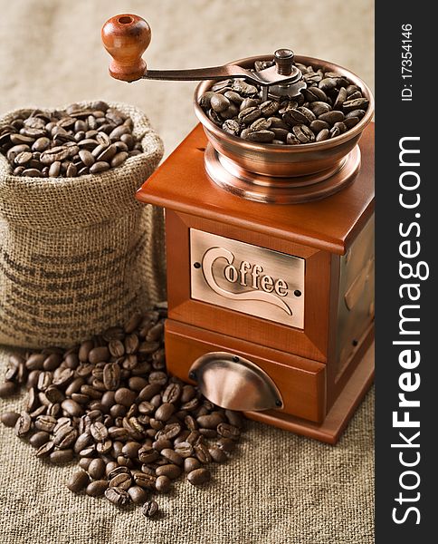 Coffee beans in bag and coffee mill