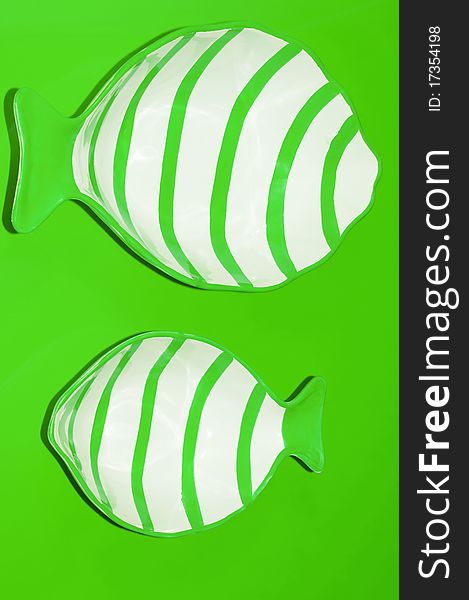 Two green fishes in a imaginarium green sea
