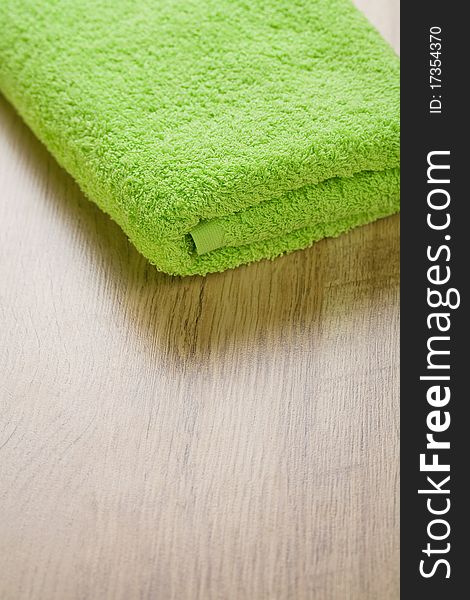 Cotton towel on brown wooden background