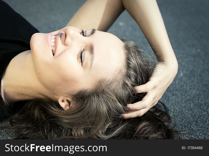 Portrait of a beautiful young lady smiling with closed eyes. Portrait of a beautiful young lady smiling with closed eyes