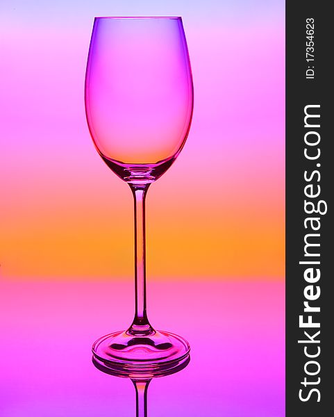 Empty glass on a colored background