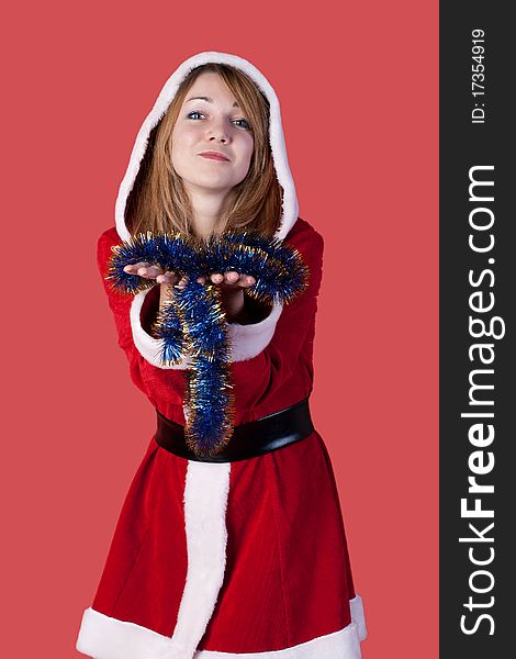 Girl as Santa Claus on red background