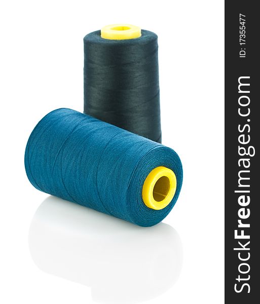 Blue And Black Threads On Spools