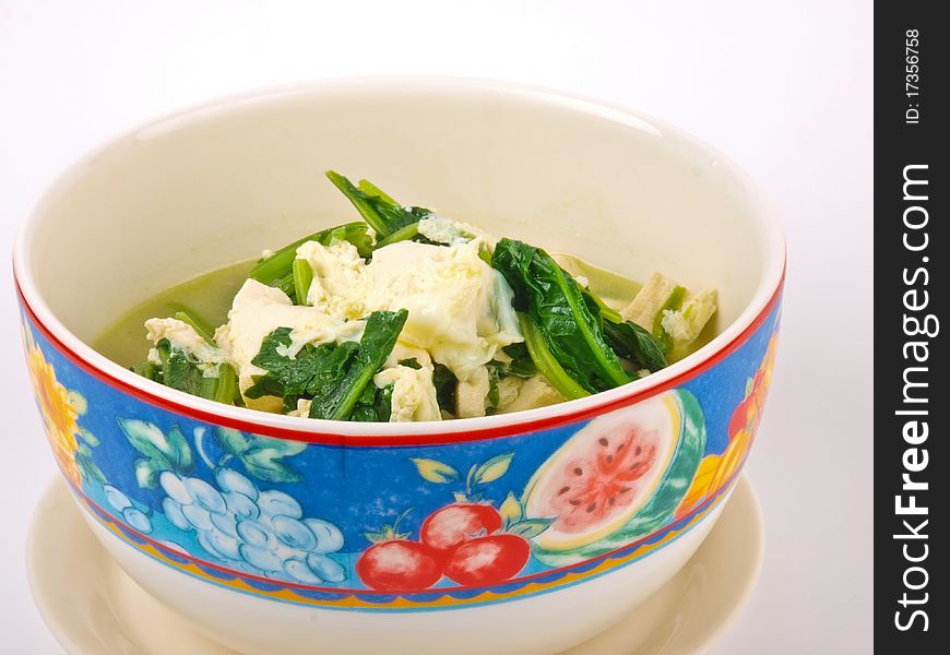 Tofu soup, close up, on white background