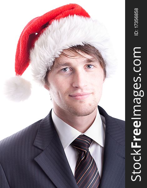 A business man in a suit wearing a Santa Claus hat. A business man in a suit wearing a Santa Claus hat.