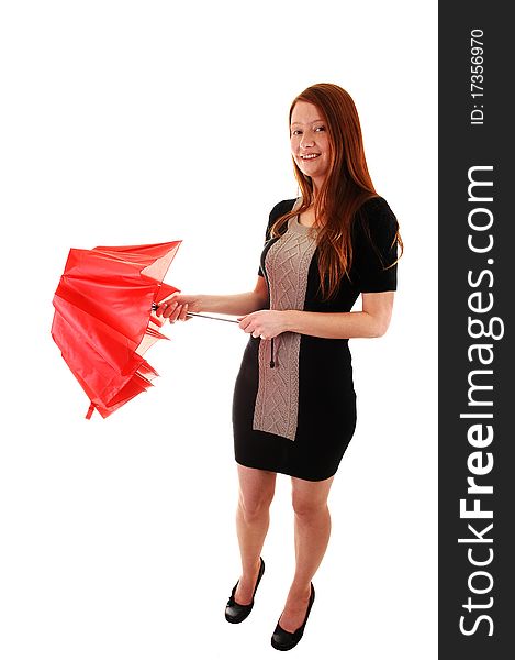 A pretty red haired woman in a black dress holding a red umbrella
in her hand, looking into the camera, on white background. A pretty red haired woman in a black dress holding a red umbrella
in her hand, looking into the camera, on white background.