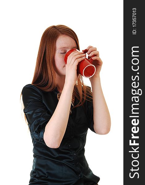 A young woman with long red hair and a mug of coffee, in a green blouse for white background. A young woman with long red hair and a mug of coffee, in a green blouse for white background.