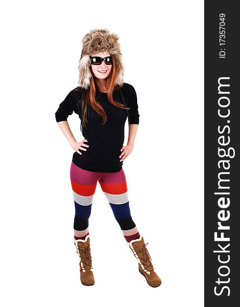A pretty woman with long red hair in colorful tights, a black sweater 
and a fur hat and brown boots smiling for a portrait for white background. A pretty woman with long red hair in colorful tights, a black sweater 
and a fur hat and brown boots smiling for a portrait for white background.
