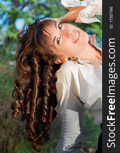 Portrait of beautiful young woman with curls