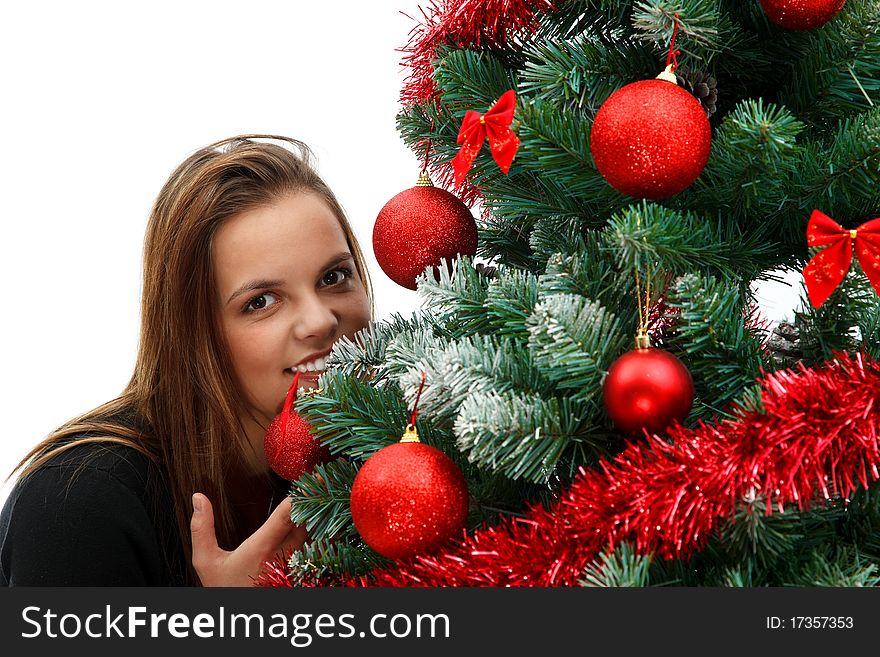 Beautiful young woman near the Christmas tree. Beautiful young woman near the Christmas tree