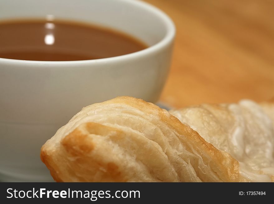 Creamed coffee and fresh baked turnover for breakfast. Creamed coffee and fresh baked turnover for breakfast