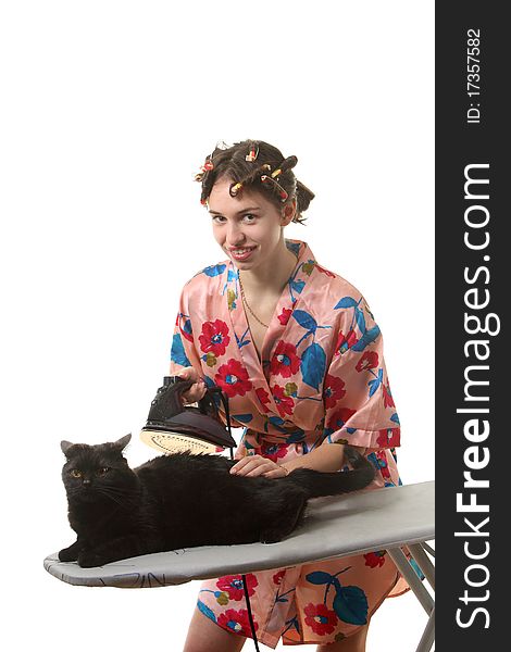 Housewife with ironing a cat