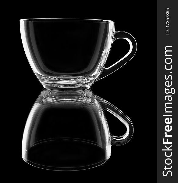 Transparent cup with reflection on black background