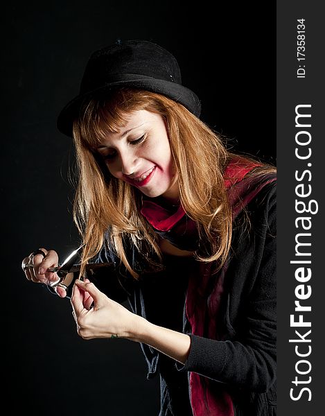 Dark girl with red scarf and black hat rusty scissors