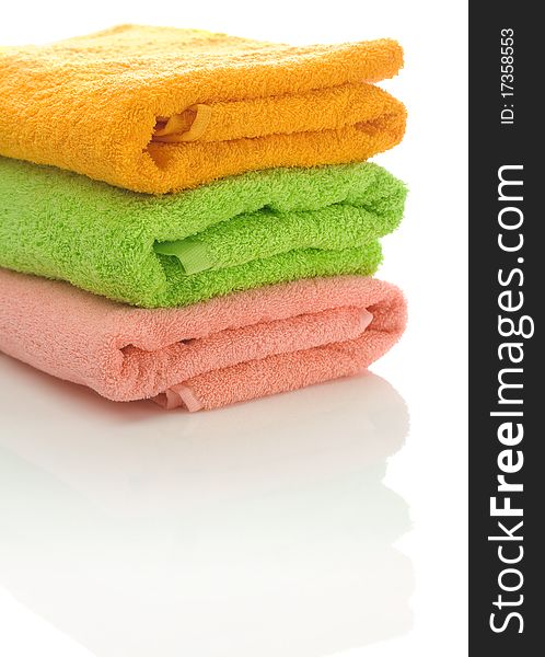 Stack of three cotton towels isolated on white background. Stack of three cotton towels isolated on white background