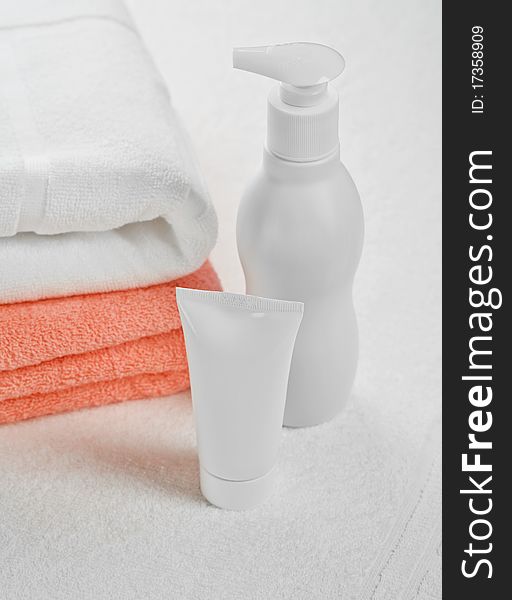 Composition of cotton towels tube and bottle