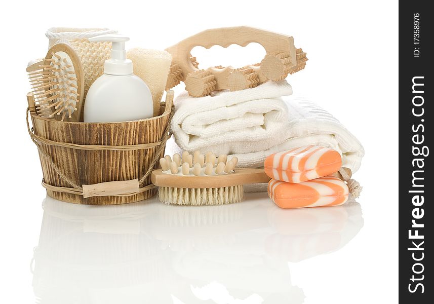 Accessories for bathing
wooden bucket, hairbrush, massager
white plastical bottle with spray
soap
white cotton towels
all its iolated on white background with reflection on white background. Accessories for bathing
wooden bucket, hairbrush, massager
white plastical bottle with spray
soap
white cotton towels
all its iolated on white background with reflection on white background