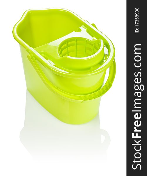 Empty plastic yellow bucket isolated on white background with reflection on white blurry background. Empty plastic yellow bucket isolated on white background with reflection on white blurry background