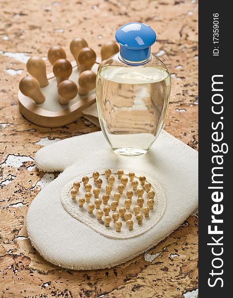 Bath accesories massager bottle and bast on a background of cork tree