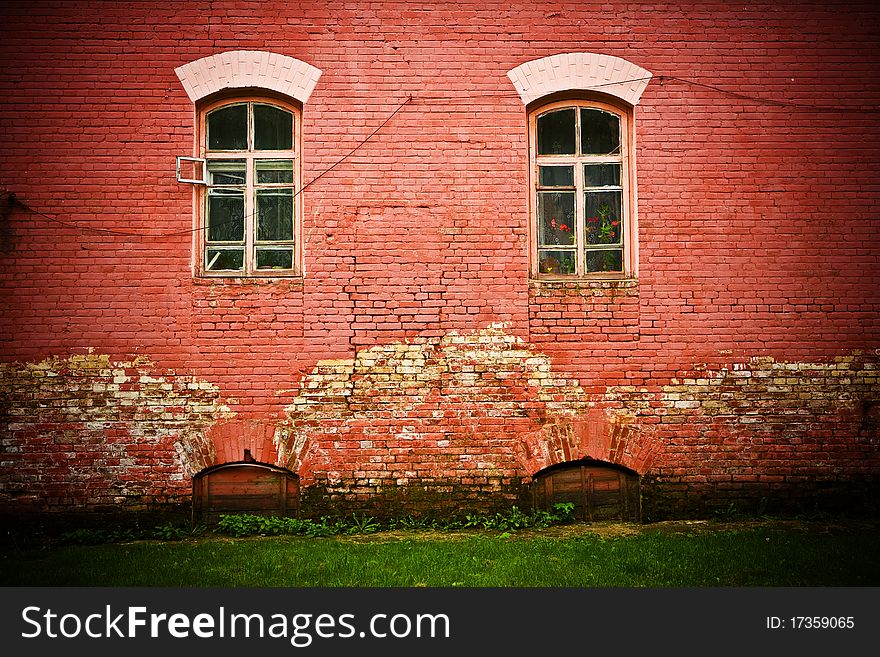 Background of old red grunge wall with two windovs. Background of old red grunge wall with two windovs