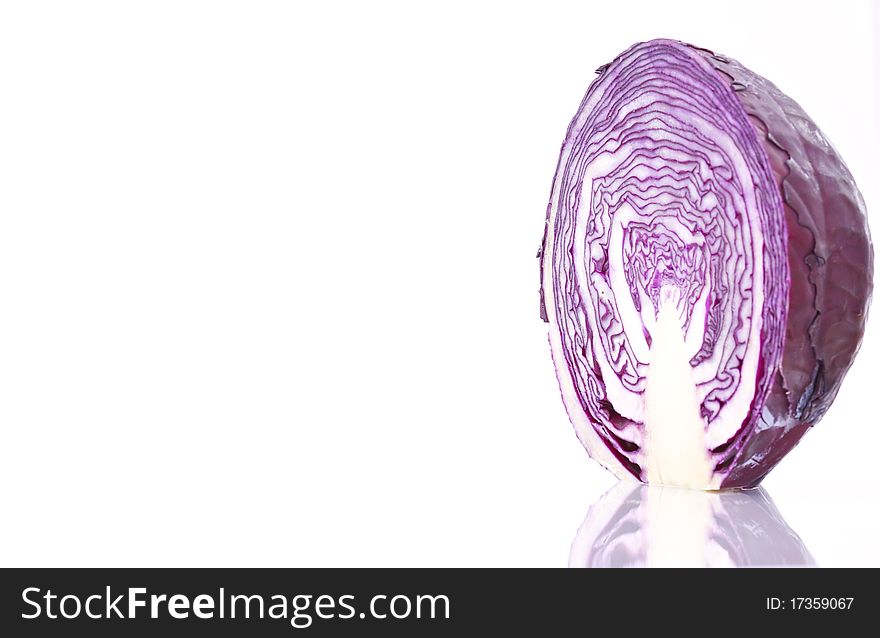 Close up of an organic purple cabbage, isolated on white background.