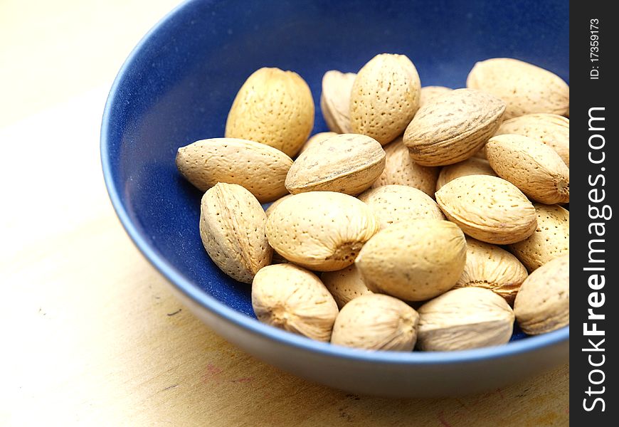 Unshelled almonds in a bowl